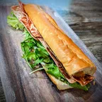 Saigon vegan banh mi sandwich with vegan pâté, garlic aioli, vegan bacon, and pickled carrots and daikon at Saigon Vegan in Garden Grove, CA