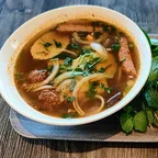 Bowl of spicy vegan bun bo Hue, a lemongrass-spiced Vietnamese noodle soup at Saigon Vegan in Garden Grove, CA