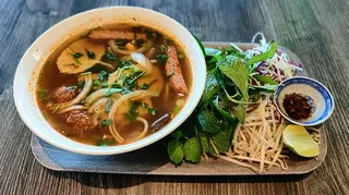 Bowl of spicy vegan bun bo Hue, a lemongrass-spiced Vietnamese noodle soup at Saigon Vegan in Garden Grove, CA