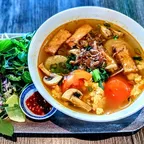Rice noodle tomato soup (bun rieu) with tofu, mushroom, and water spinach at Saigon Vegan in Garden Grove, CA