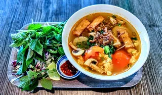 Rice noodle tomato soup (bun rieu) with tofu, mushroom, and water spinach at Saigon Vegan in Garden Grove, CA
