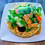 Crispy fried chow mein (mi xao don) with vegan chicken and vegetables at Saigon Vegan in Garden Grove, CA