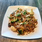Stir-fried garlic noodles with vegan chicken, mushroom, and broccoli at Saigon Vegan in Garden Grove, CA