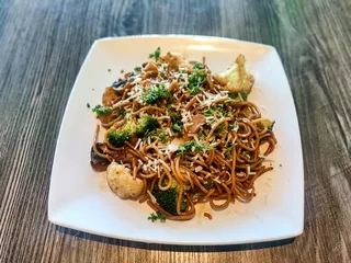 Stir-fried garlic noodles with vegan chicken, mushroom, and broccoli at Saigon Vegan in Garden Grove, CA