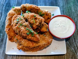 Crispy battered portobello mushroom tenders with garlic aioli, a best-selling vegan appetizer at Saigon Vegan in Garden Grove, CA