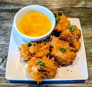 Close-up of the orange cauliflower appetizer at Saigon Vegan in Garden Grove, CA